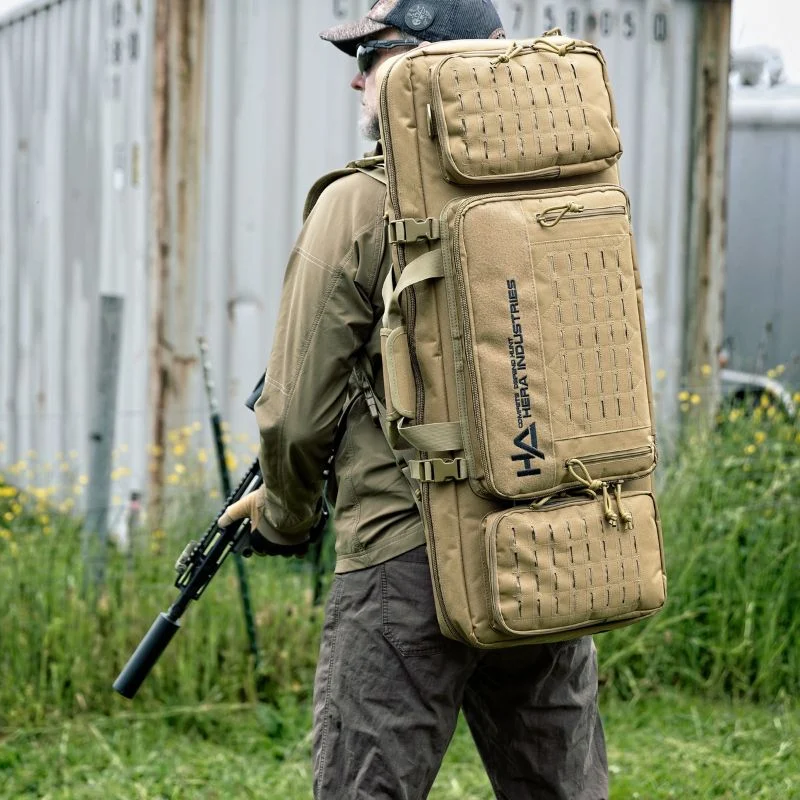 Bag and Mag Bundle 21 Person wearing rifle bag as a backpack.